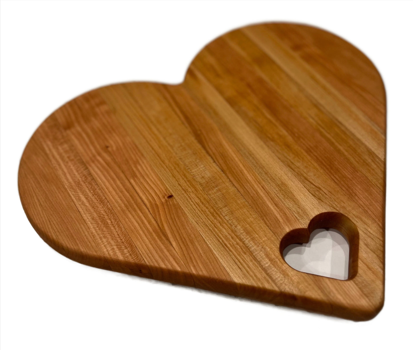 Heart-shaped charcuterie board made from premium wood, featuring a unique and charming design perfect for serving cheeses, meats, and appetizers.