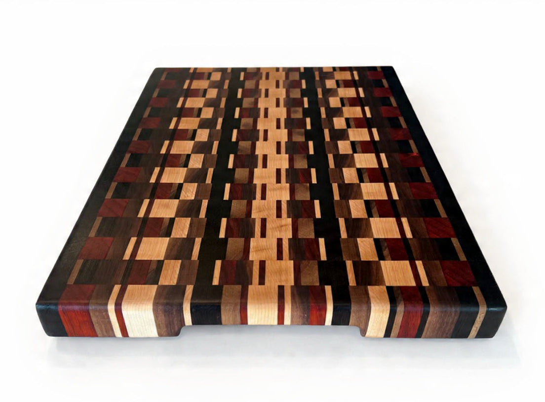 Wooden cutting board with a checkered pattern on a white background
