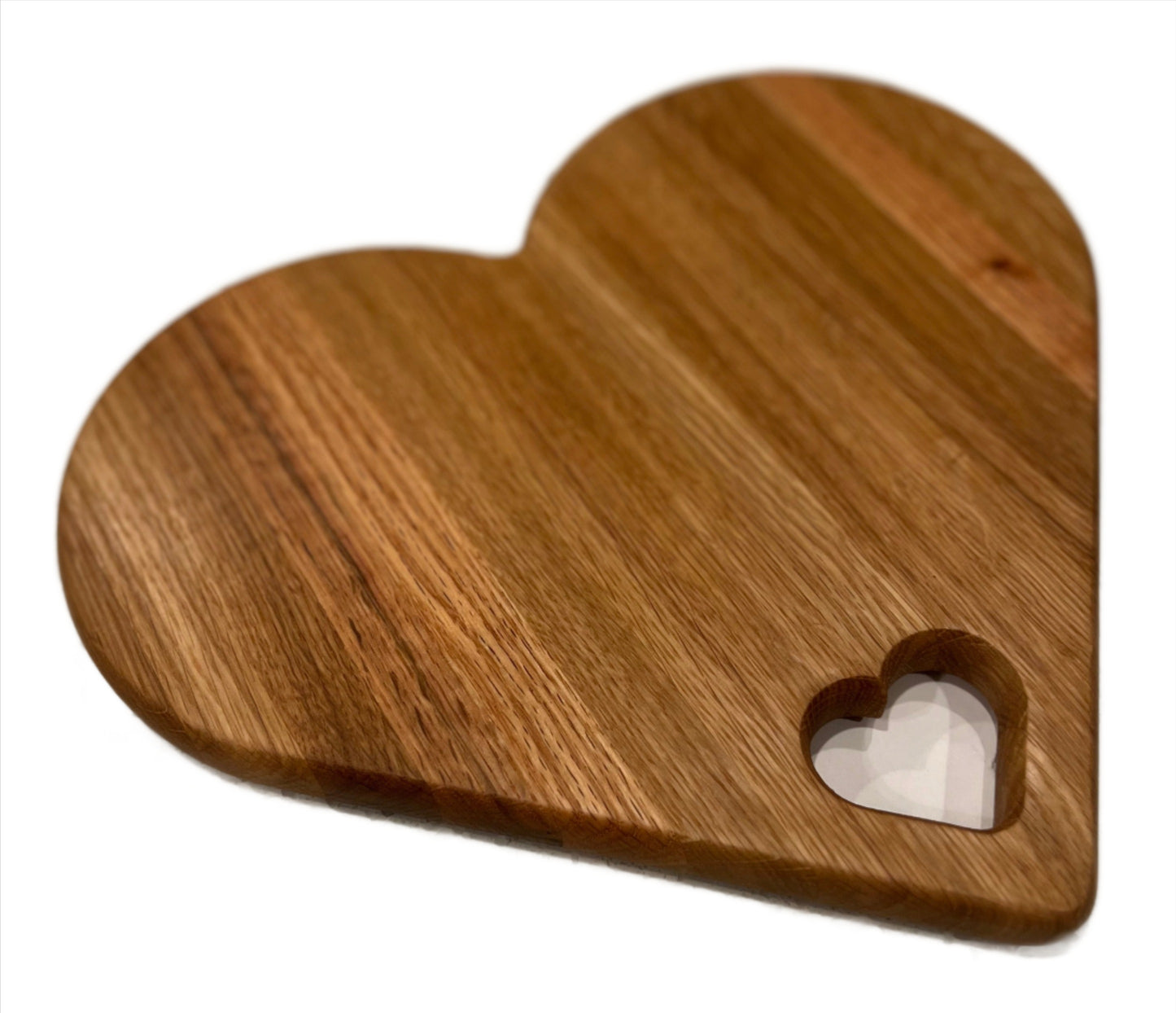 Heart-shaped charcuterie board made from premium wood, featuring a unique and charming design perfect for serving cheeses, meats, and appetizers.
