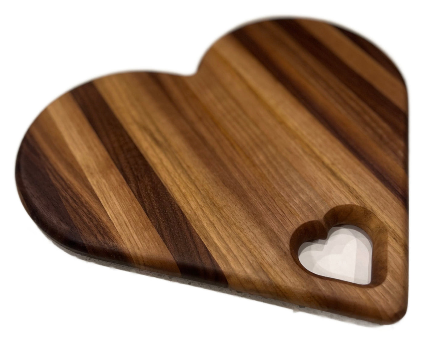 Heart-shaped charcuterie board made from premium wood, featuring a unique and charming design perfect for serving cheeses, meats, and appetizers.