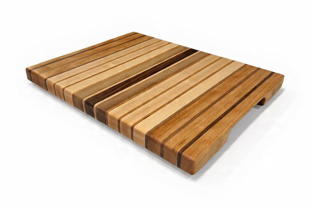 Wooden cutting board with slatted design on a white background