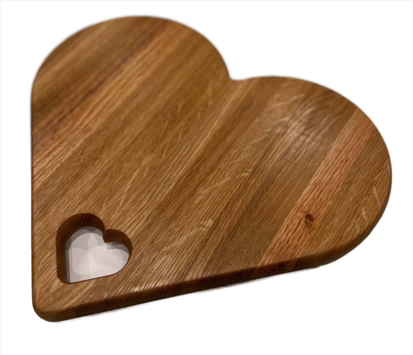 Heart-shaped charcuterie board made from premium wood, featuring a unique and charming design perfect for serving cheeses, meats, and appetizers.