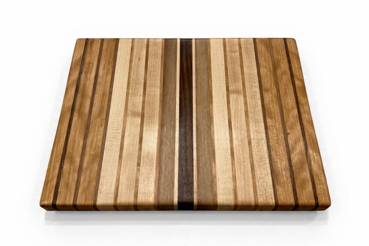 Wooden cutting board with striped pattern on a white background