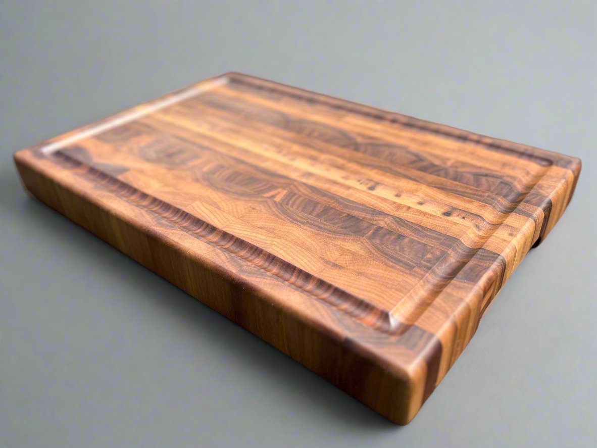 Large end grain walnut cutting board with a robust, textured surface that highlights the rich wood grain and provides durability for heavy use.