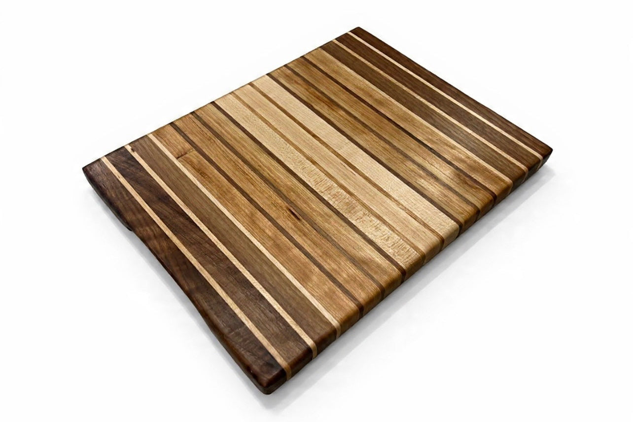 Wooden cutting board with striped pattern on a white background