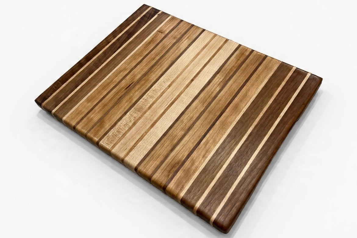 Wooden cutting board with striped pattern on a white background