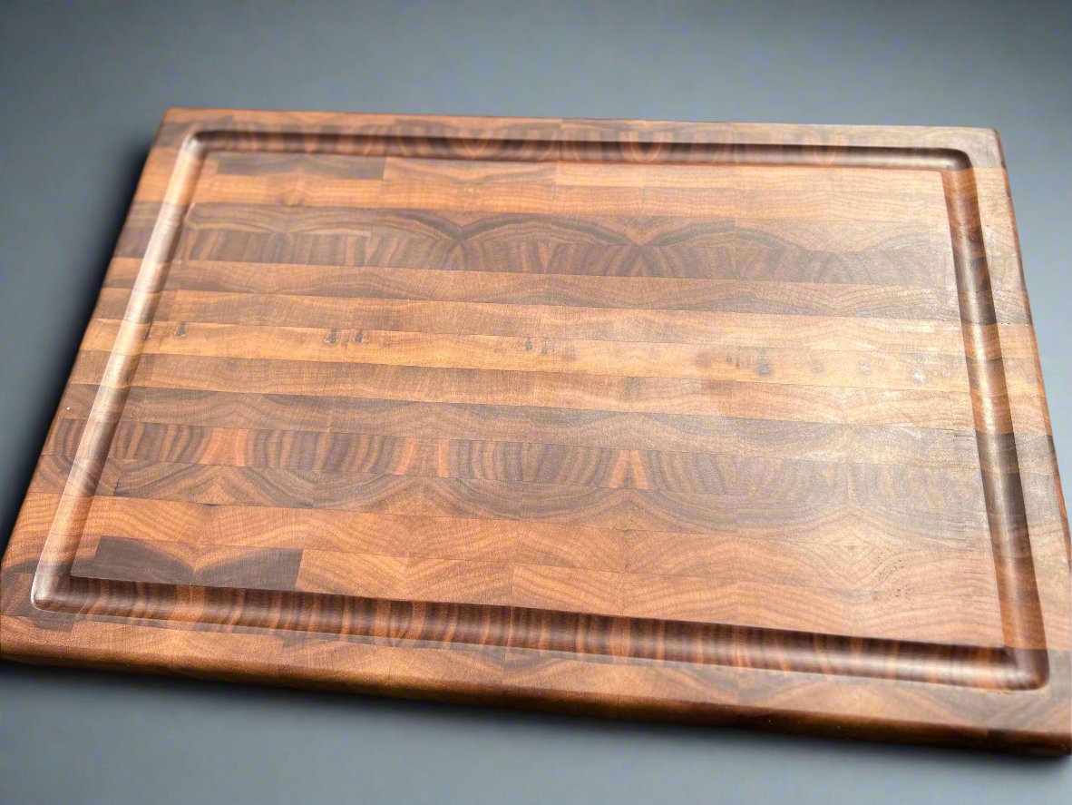 Walnut cutting board featuring a dark, elegant finish and rich wood grain, ideal for stylish and durable kitchen use.